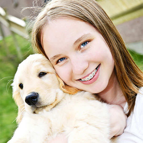Girl with braces and dog